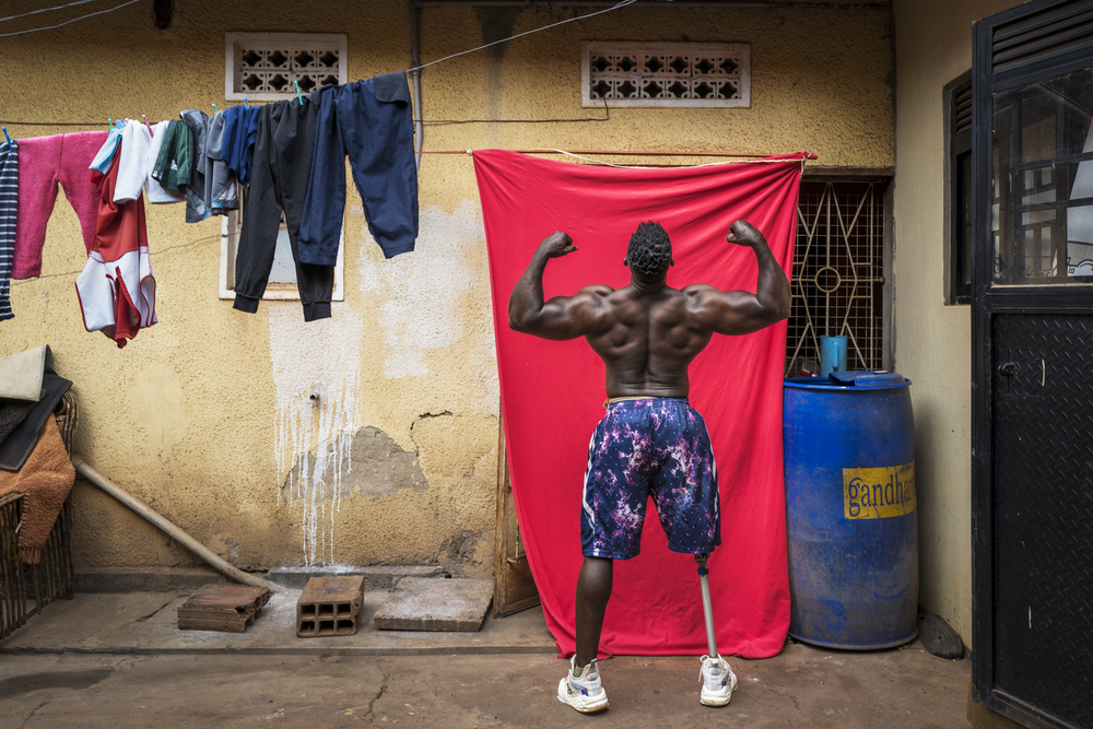 Marijn Fidder KAMPALA, UGANDA - Tamale Safalu trains in front of his home in Kampala, Uganda. Since he was little, he wanted to become a body builder. He succeeded but got a terrible motorcycle accident, causing him to loose one of his legs. Despite losing his leg